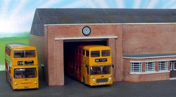 The garage in a simply diorama with more modern type buses - Click to enlarge